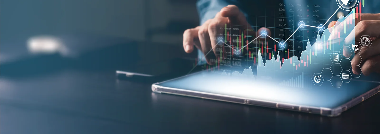 Businessman viewing virtual graphs on a tablet