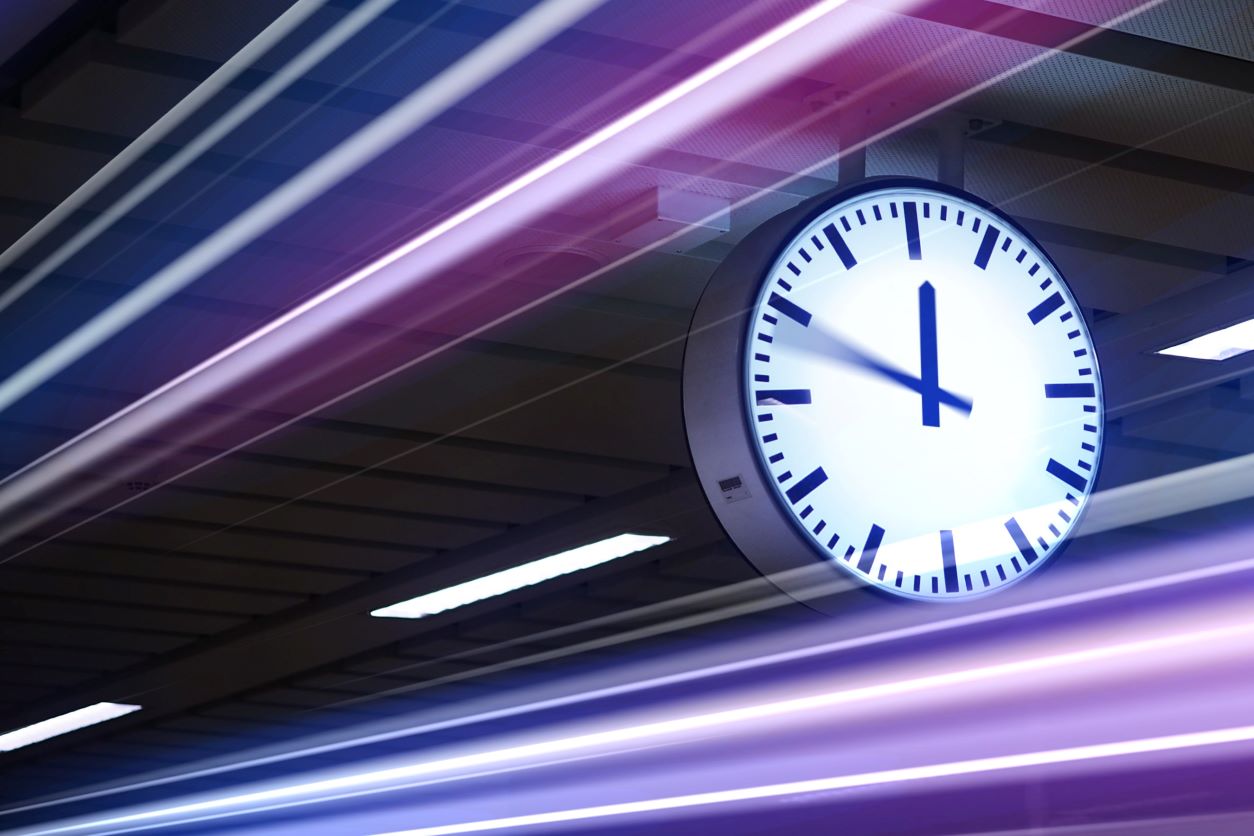 a clock with purple abstract lines of light around it