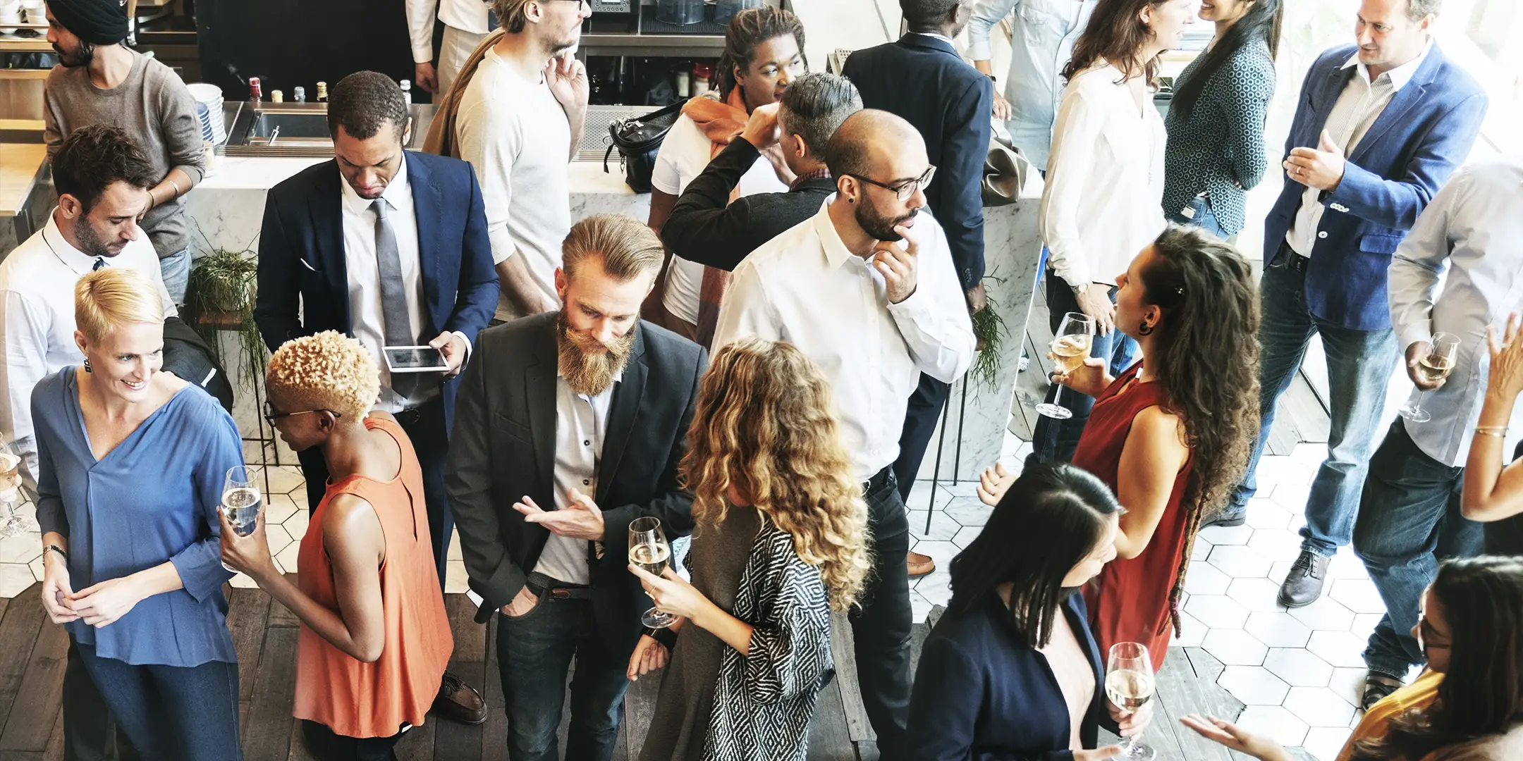 People standing around talking at a conference