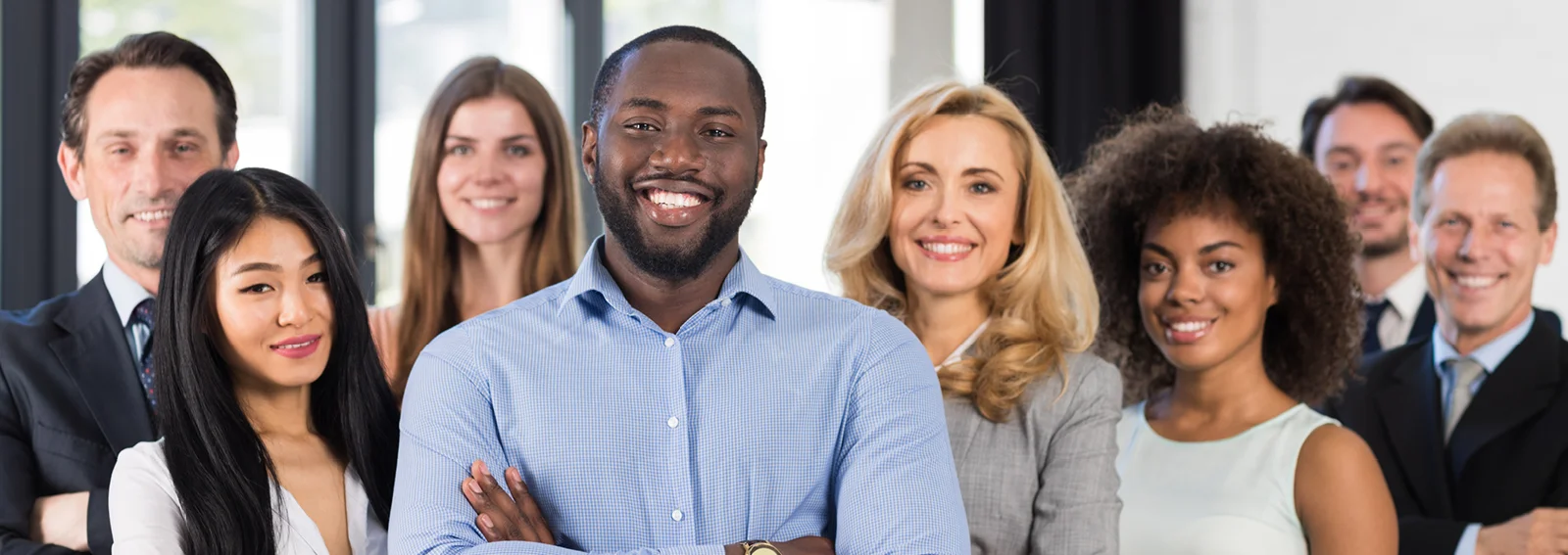 A group of coworkers smiling 