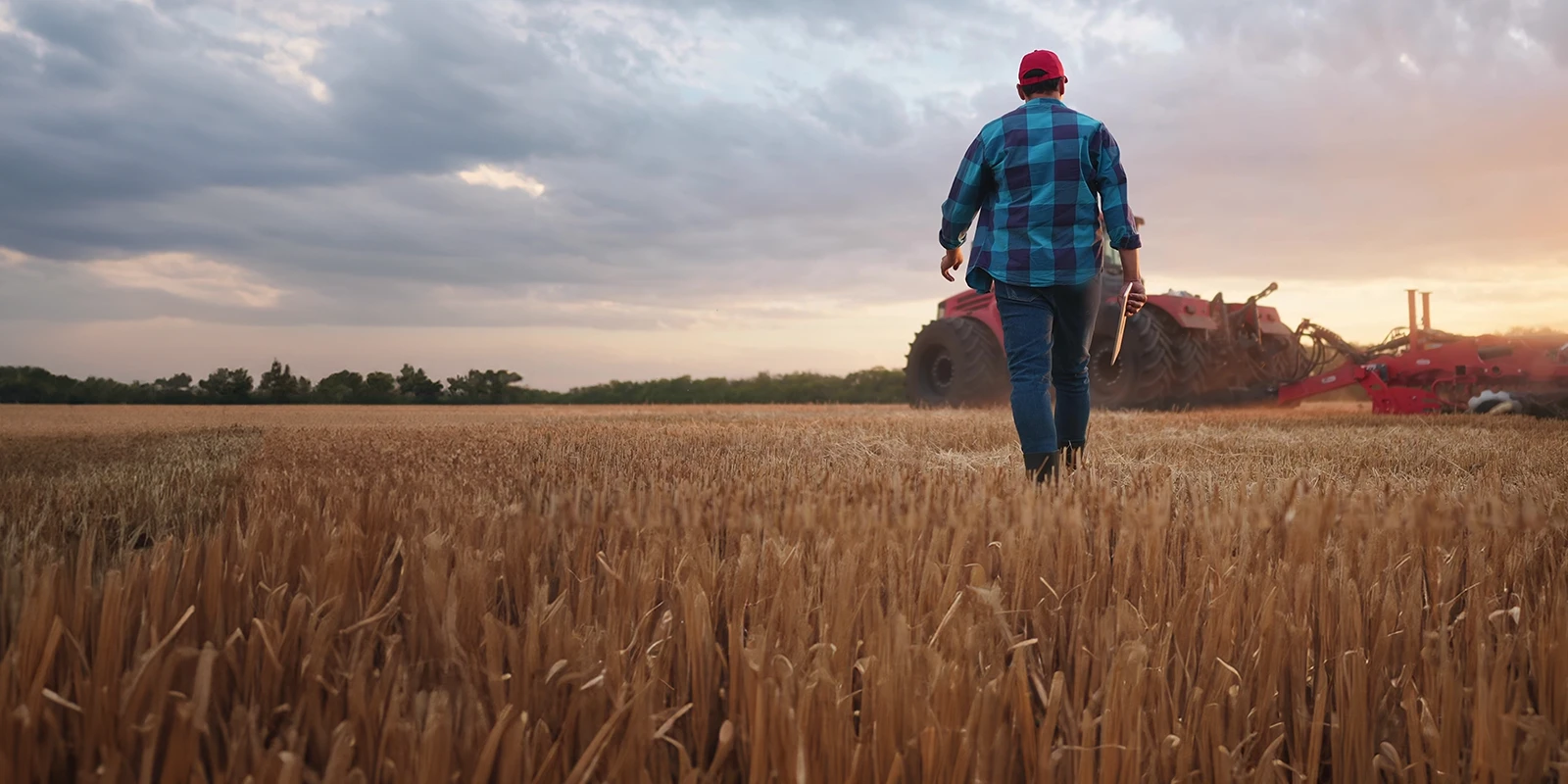 Farmer walking to his tractor