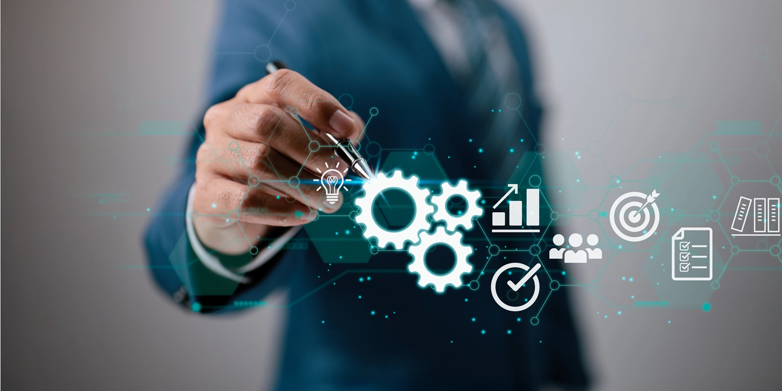 business man pointing to business icons with pen