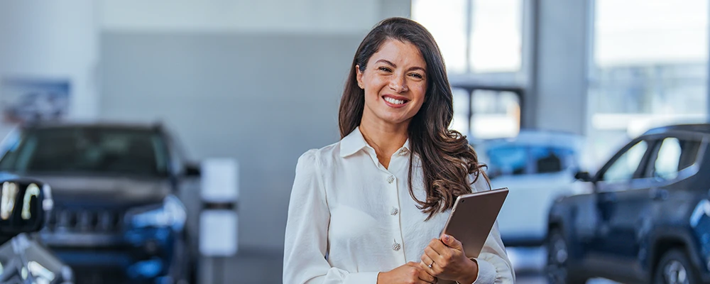 Woman smiling in a dealership