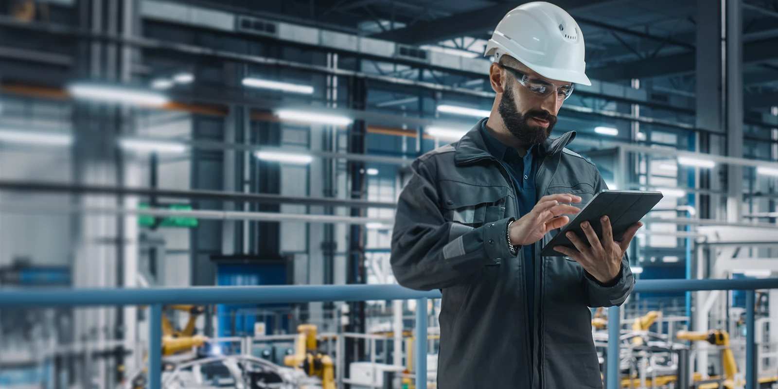 Engineer reviewing data on a tablet.