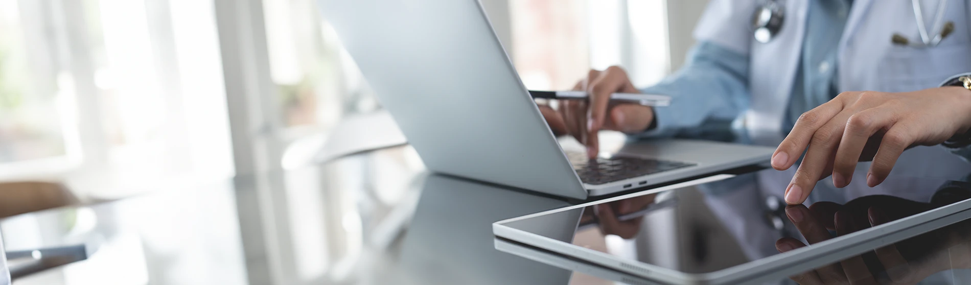 Physician working on a tablet in their office