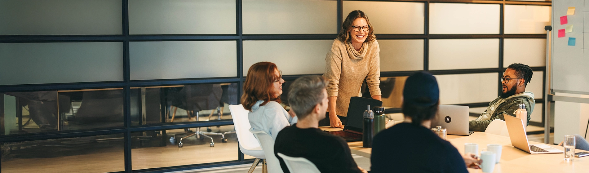 Group of people collaborating in a board room