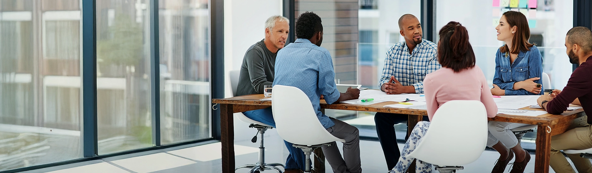 Group of professionals working in a board room