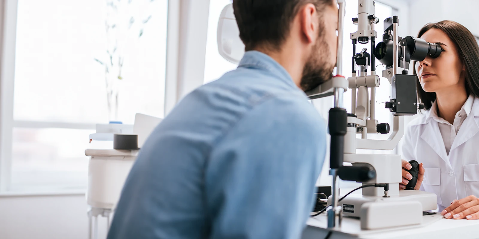 Optometrist checking a patients eyes