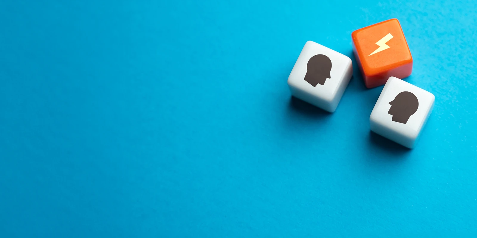 dice on a blue background representing dispute between two people