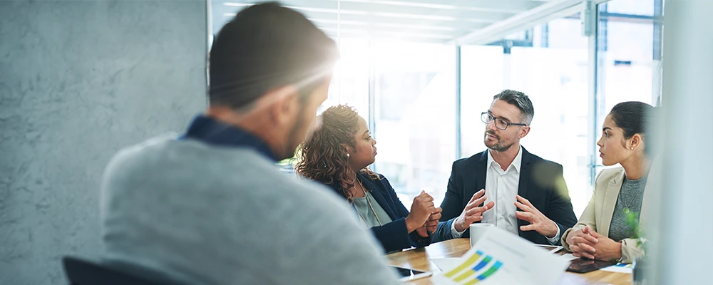 diverse business team discussing an acquisition