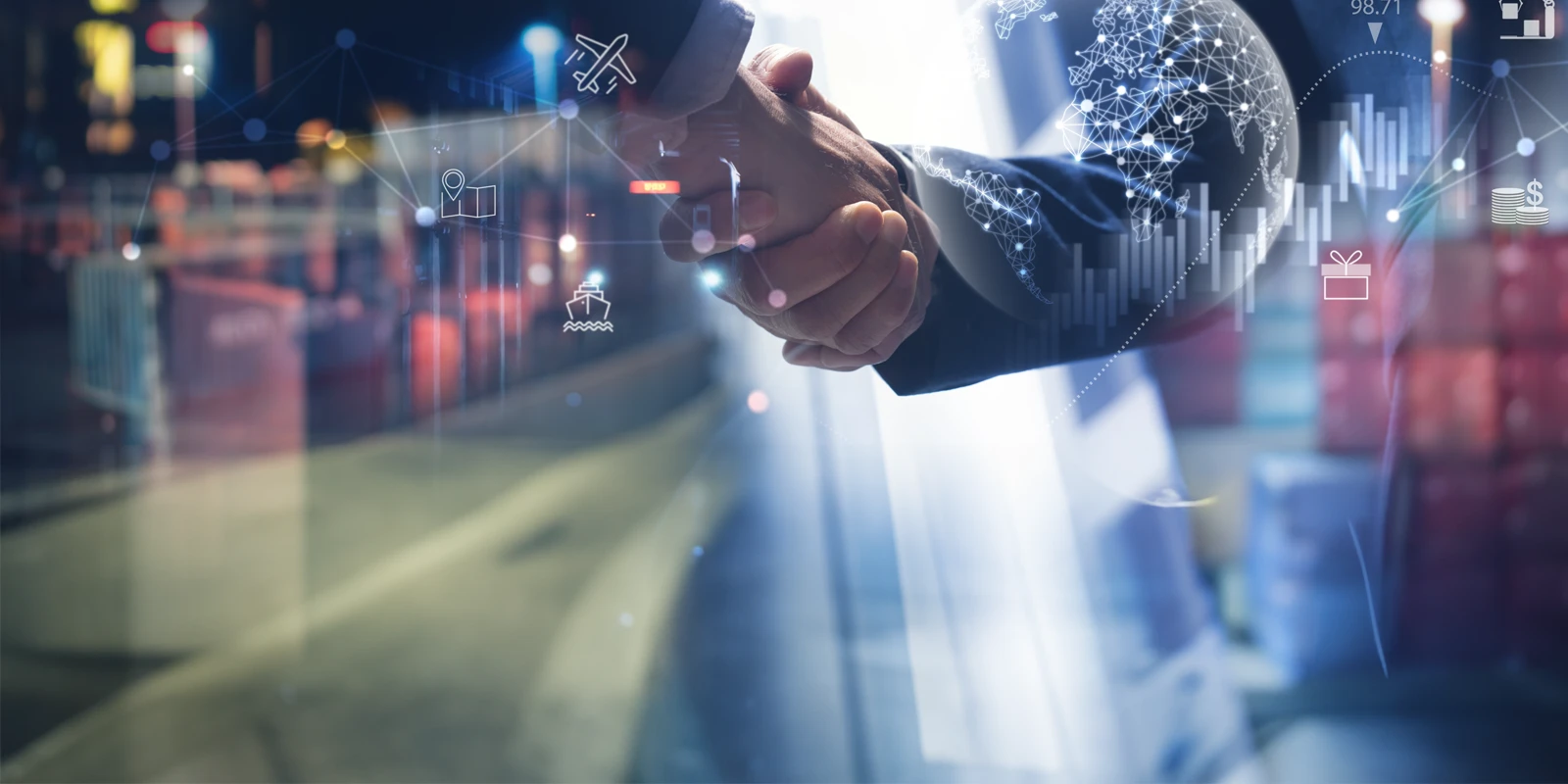 Two men shaking hands with a blurry background of an office.