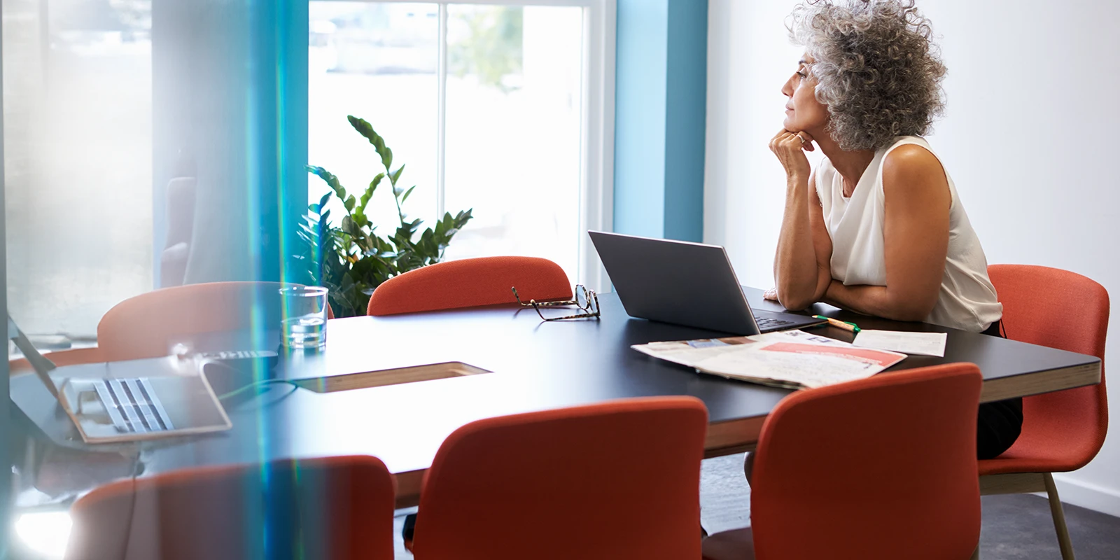 Mature business woman lost in thought.