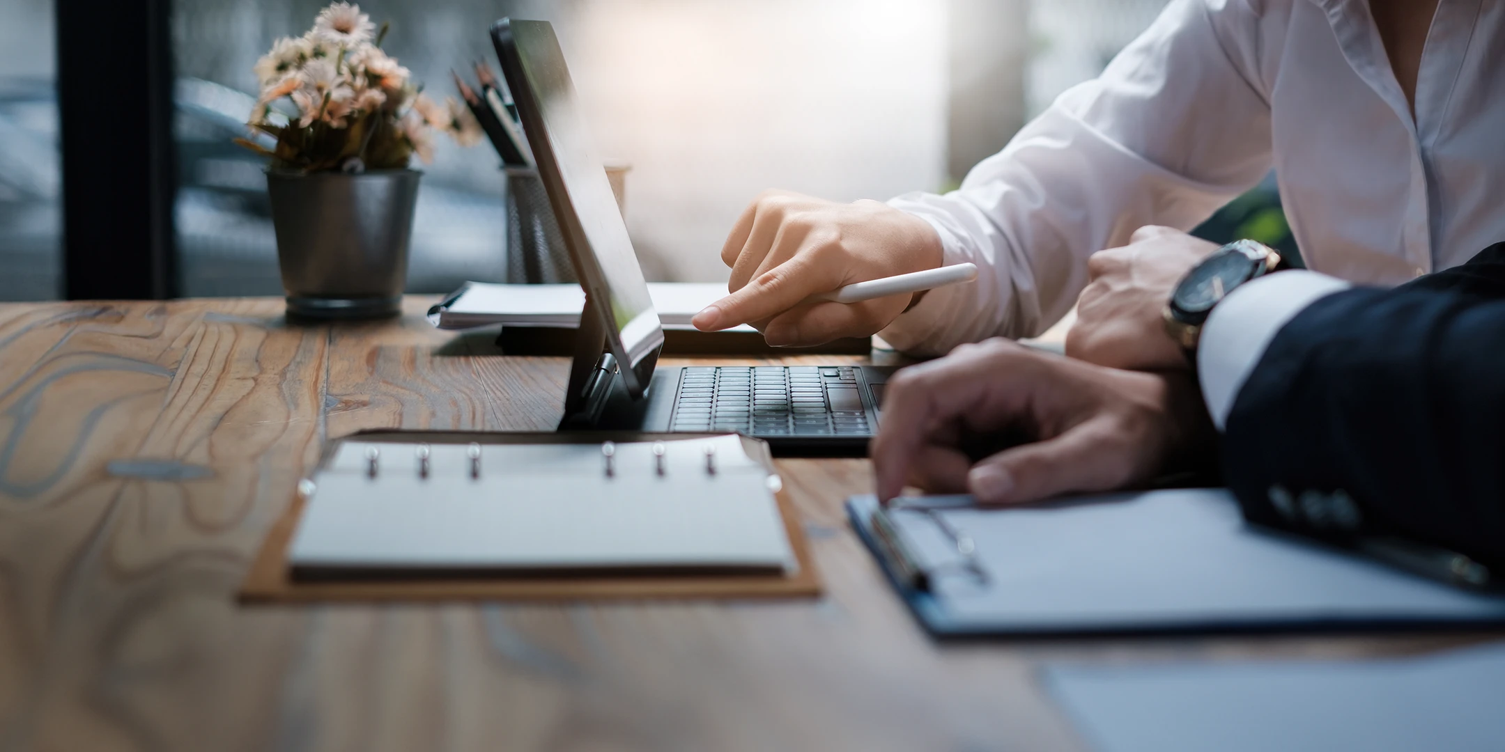 Person working on tax updates on a tablet device