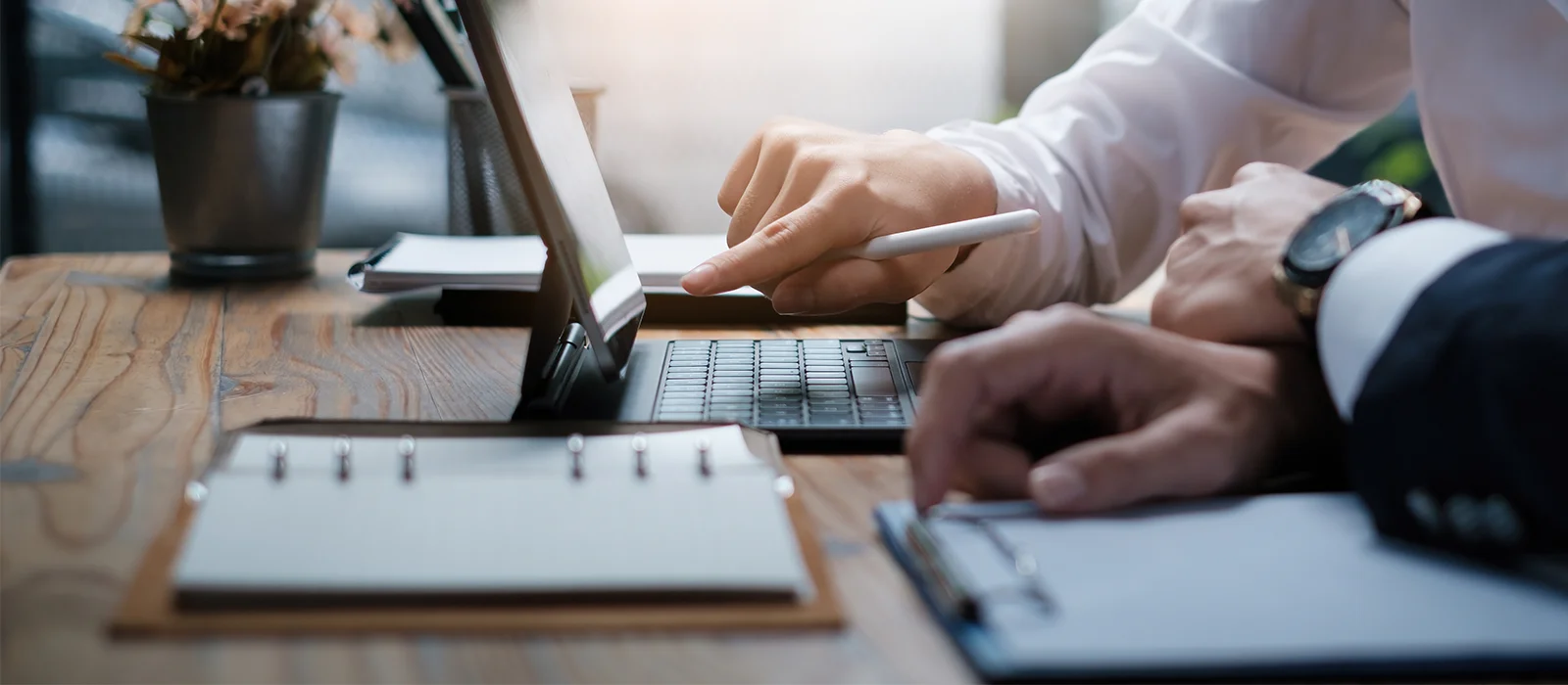 Business team reviewing tax documents on a tablet